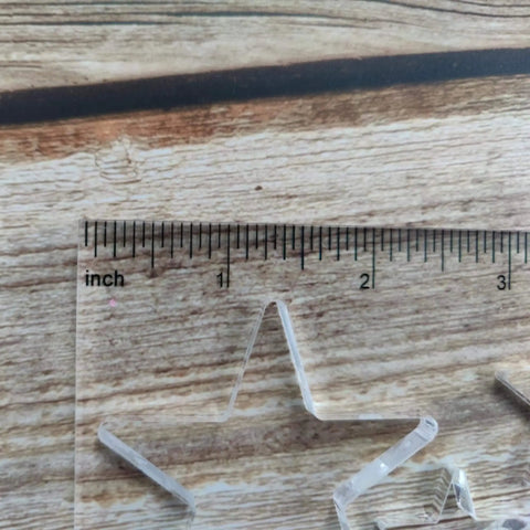 Close-up of Bowtie Router Template Kit for Woodworking with star inlay, one quarter inch thick acrylic, on wood surface
