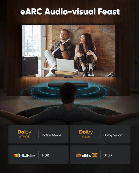 Living room TV setup with Dolby Atmos, Dolby Vision, HDR, DTS:X features displayed, person watching TV from couch.
