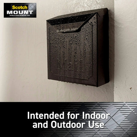 Mailbox mounted with double-sided heavy-duty mounting strips and tape for walls and outdoor use, showing raindrops.