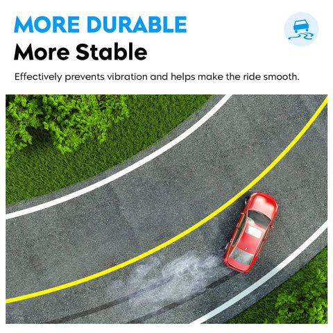 Red car driving on curved road with yellow line, demonstrating improved stability and durability of suspension upgrade.