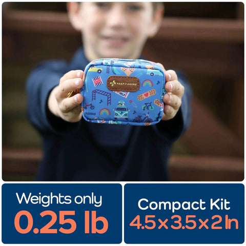 Child holding Compact Travel First Aid Kit For Kids With Sixty-Piece Set And Latex-Free Bandages in blue case