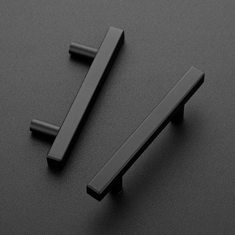 Two matte black cabinet pulls with three inch handles, showing stainless steel durable hardware, from Thirty Pack Matte Black Cabinet Pulls.