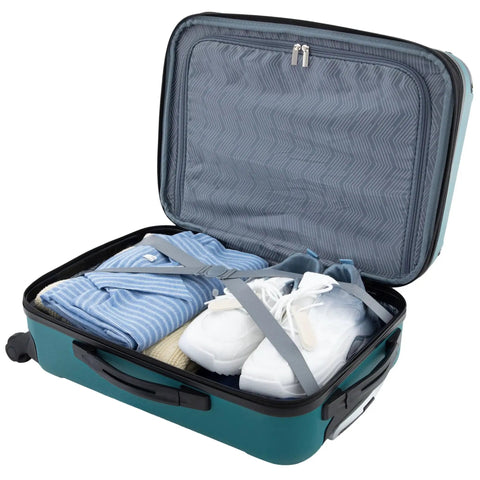 Open view of teal 22 inch expandable hardside spinner carry on luggage with ABS shell, packing straps holding clothes and shoes inside.