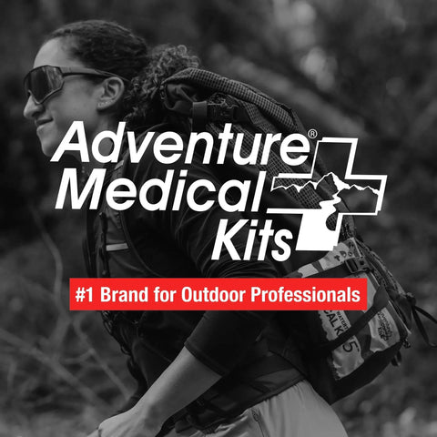 Adventurer carrying Ultralight Watertight First Aid Kit For Up To 2 People And 2 Days With Bandages Blister Essentials And More logo
