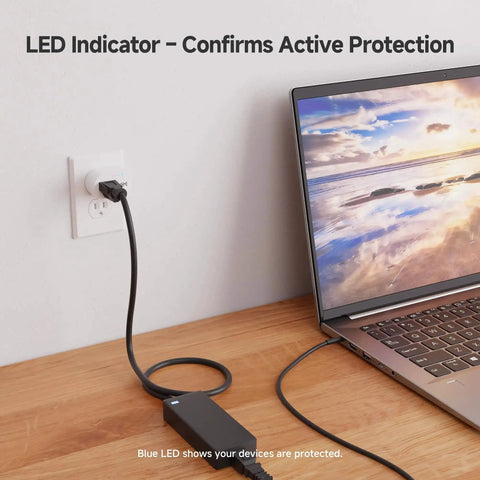 3 Pack Non Blocking 750 Joules Surge Protector With 500V Clamping Voltage connected beside laptop