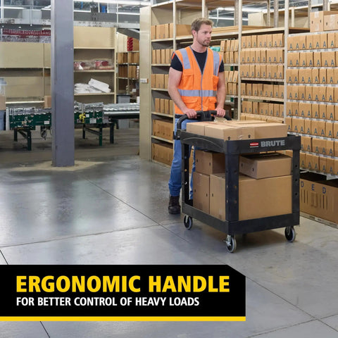 Worker using Two Shelf Foam Utility Cart With Lipped Shelves And Ergonomic Handle Black 500 Lb Capacity Durable Rolling Cart in warehouse