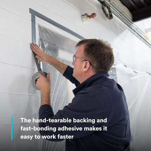 Man applying Multi-Use Silver Duct Tape 1.88 in x 60 yd x 7 mil, 1 Pack, Contractor Grade Temporary Repair on wall for sealing.