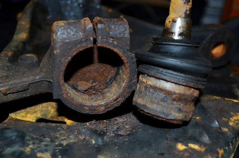 Rusty ball joint in Subaru vehicle suspension prior to using Ball Joint Puller Remover For Seized Subaru Vehicles With Slide Hammer Adapter.
