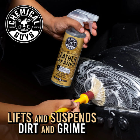 Leather Cleaner For Cars And Home Use With Colorless Odorless Formula PH Balanced Safe On Natural Synthetic Pleather And Faux Leather 473 Ml By Chemical Guys Today, spray bottle in hand, cleaning leather seat.