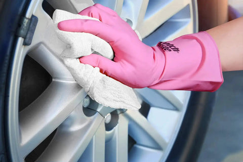 Person cleaning car wheel with Tough As Nails Cotton Shop Towels 12x14 Inches Pack Of 50 Plus 5 Bonus Reusable Cleaning Rags 100 Percent Cotton