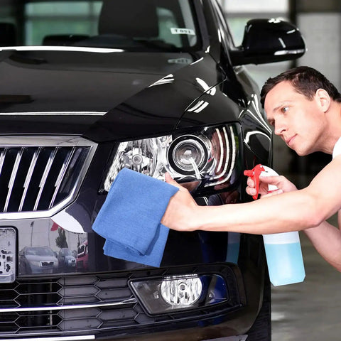 Man cleaning black car with Blue Huck Towels 50 Pack Bulk Absorbent Cotton Shop Towels 25.2 By 16.93 Inches Great For Home Bars Hotels Auto Shops Garages And Cleaning Rags Rely On For Quick Wipes And Heavy Duty Cleaning