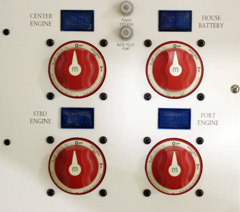 Blue Sea Systems 6006 m-Series four red battery isolator switches on a white control panel