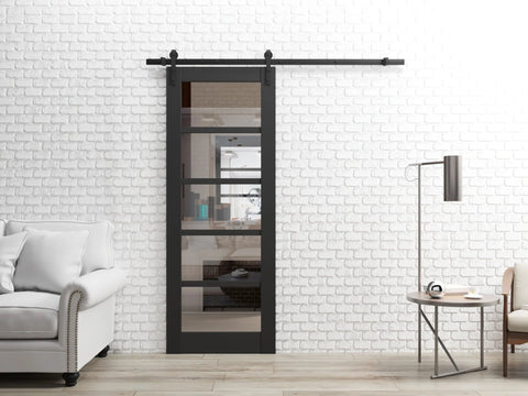 Interior Single Sliding Barn Door With Clear Glass And MDF, 42x80 Inches, Black, Modern Style, installed in living room.