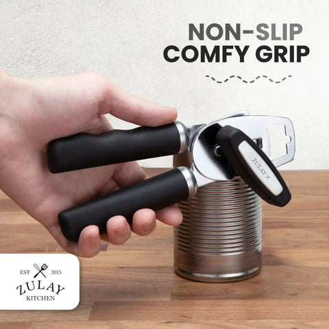 Person using Comfy Manual Can Opener With Bottle Opener, Rust Proof Stainless Steel, Turn Knob, Soft Grip Handles on a can