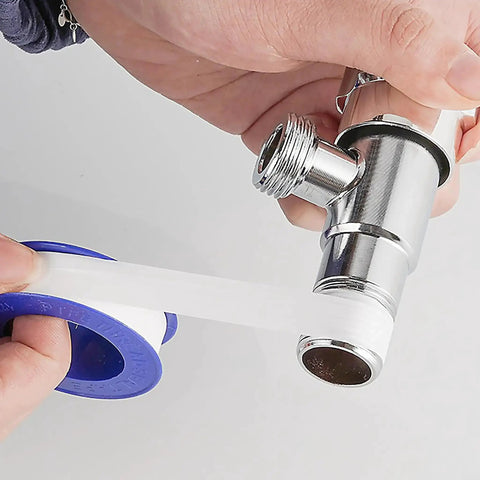 PTFE Plumbers Tape Two Pack 0.5 Inch Wide Teflon Tape For Pipe Thread Sealing And Keeps Leaks At Bay On Shower Heads Garden Hoses And All Plumbing Connections Durable Heat Resistant And Easy To Use applied to a metal pipe.