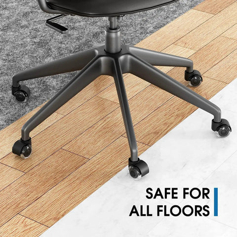 Office chair with 2 Inch Replacement Office Chair Caster Wheels With Soft Mute Rollers on wood and tile flooring