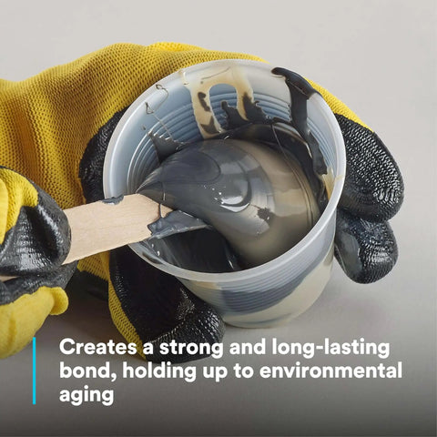 Mixing Epoxy Adhesive 2216 Gray Heat-Resistant Two-Part B/A Tube Kit in a cup with gloved hands
