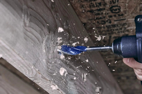 Fast Wood Drill Bit Set For Quarter Inch Quick Change Chucks With Tri Flute Design in action drilling into wood surface