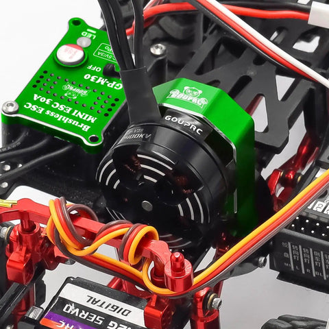 Close-up of 2204 2400KV Brushless Outrunner Motor with transmission and 30A Mini ESC installed in SCX24 remote crawler kit
