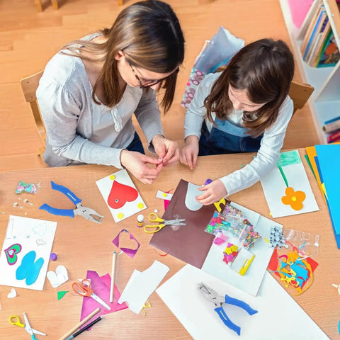 One Hole Paper Punch With Soft Grip Handle One Quarter Inch Hole Puncher used in crafting activity with child and adult.