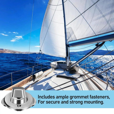 Stainless steel marine twist-lock fastener on sailboat deck with white sails in background.
