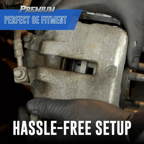 Bendix SBM679 front brake pads installed in caliper, semi-metallic, close-up view