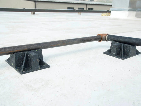 Saddle Support Rooftop Pipe Stand Go To For Gas Piping And Electrical Conduit Pipe Cradle Sleeper Curb installed on roof.