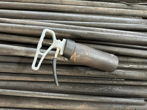 Retractable Neodymium Magnetic Pickup Tool With Release Handle For Iron Plate lying on metal rods