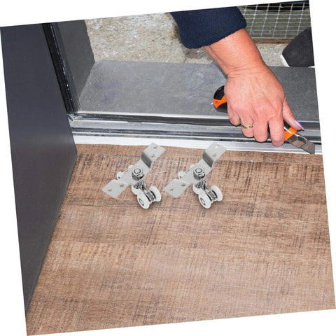 Stainless Steel Sliding Door Track Wheels With Nylon Rollers Silent Pulley System For Quiet Smooth Operation installed on floor