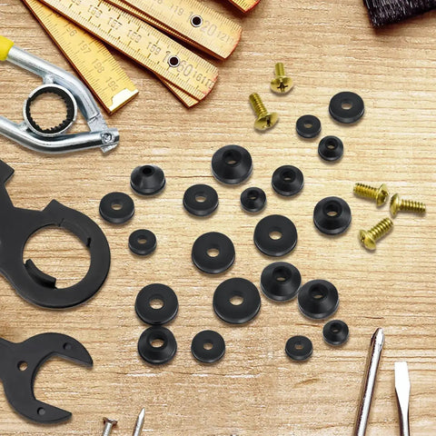 106 Piece Faucet Washer Kit with assorted flat and beveled rubber washers, brass screws, tools on wooden surface for repair and replacement