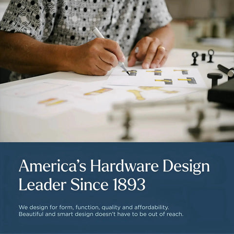 Designer at work desk sketching kitchen hardware designs, showcasing America's hardware design leadership since 1893.