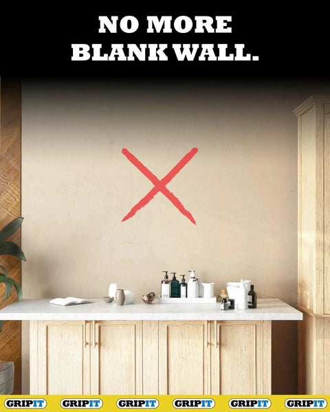 Bathroom vanity with products on counter, blank wall with red X symbol and 'No More Blank Wall' text above, GripIt branding on bottom.