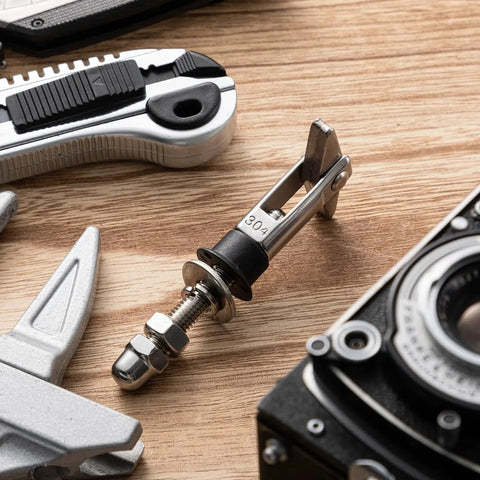 Close-up of 8 Pack M8x110mm X Shaped Toggle Bolts Heavy Duty Wall Anchors Stainless Steel 304 Scissors Type for installation.