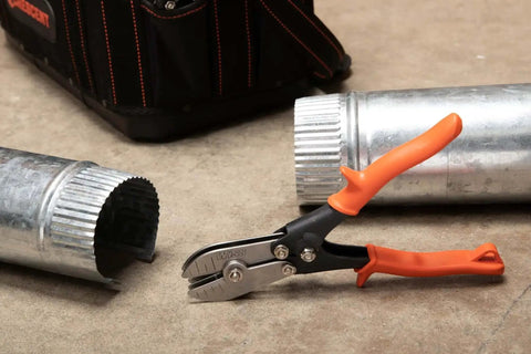 Nine and Three Quarters Inch Five Blade Hand Crimper for Gutters, Downspouts, and Metal Pipe Connections shown on concrete floor