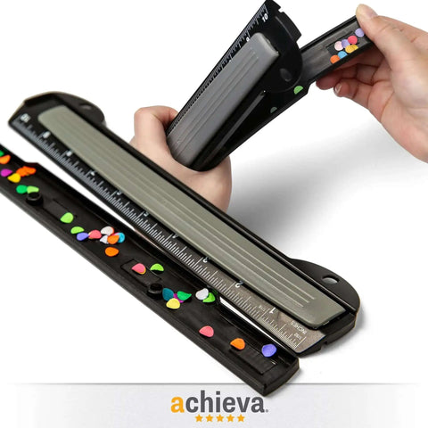 Close-up of On The Go 3 Hole Binder Punch for Ring Binders in black, ultra-compact design with ruler, used for organizing documents efficiently.
