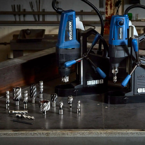 No Fuss Magnetic Drill Annular Cutter Kit With 12 Pieces For 2 Inch Depth, 7/16 To 1-1/8 Inch Widths, Weldon Shank 3/4 Inch, Carry Case Included, Fits Evolution Power Tools And Most Mag Drills placed on a table with drill bits and mag drills