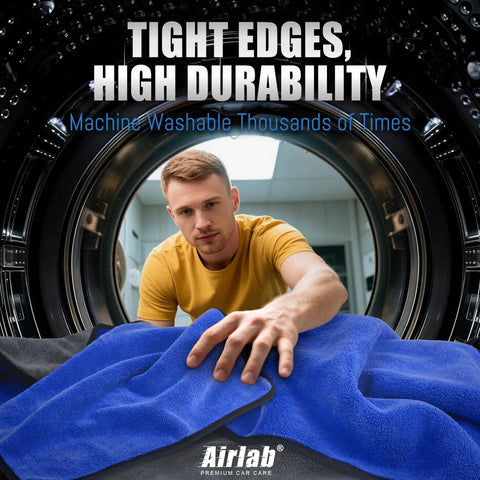 Ultra Thick 800GSM Microfiber Towels For Cars Pack Of 4 16 X 16 Inches Blue Gray shown being placed in a washing machine.