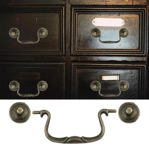 Set Of 6 Antique Bail Handle Drop Pulls With Screws In Vintage Bronze, shown on dark cabinet drawers, 3.3 inch centers