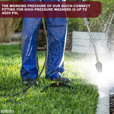 Pressure washer hose connector and black hose on green lawn with spray wand in use.