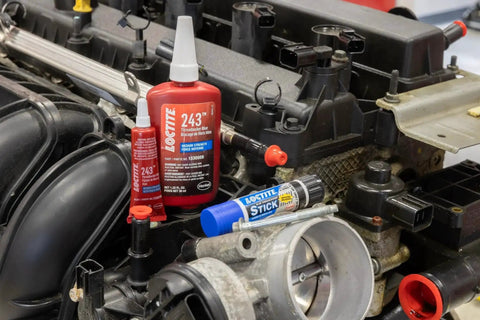 Medium Strength Surface Insensitive Threadlocker For 1/4 To 3/4 Inch Fasteners on an automotive engine with other products