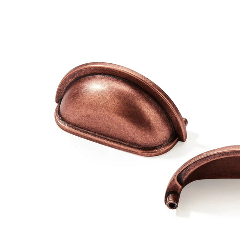 Close-up of 10 Pack 3 Inch Vintage Cup Pulls Antique Copper Cabinet Hardware with a focus on antique copper finish and shape.