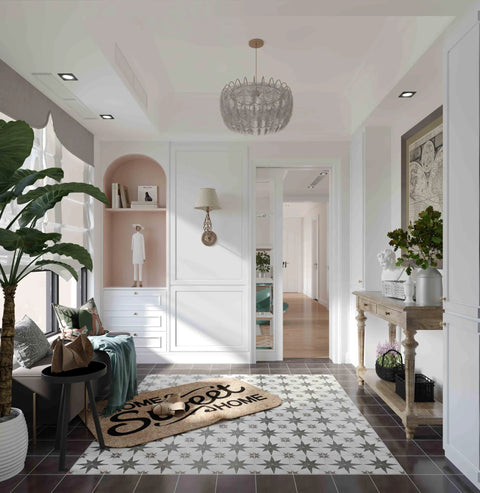 Stylish hallway with patterned floor tile, wall decor, and a home sweet home doormat