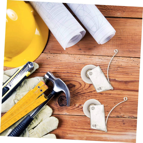 Heavy Duty Barn Door Rollers Kit With Electroplated Stainless Steel Tracks on wood surface with tools and blueprints.
