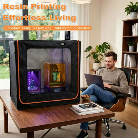 Double Wide 3D Printer Enclosure With Ventilation And Adjustable Fan shown on table with two 3D printers inside, man working nearby