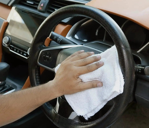 Person cleaning car steering wheel with Linen Terry Bar Mop Towels 14x17 White Value Pack Of 60 Absorbent And Durable Multipurpose Cleaning Rags Cotton Towels Terry Cloth Reusable Shop Rags Eco Friendly Recycled Cotton