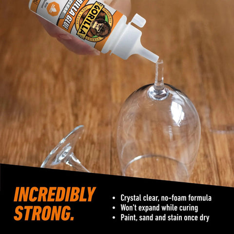 Crystal Clear All Purpose Glue For Wood Stone Metal Ceramic Water Resistant being applied to glass cup
