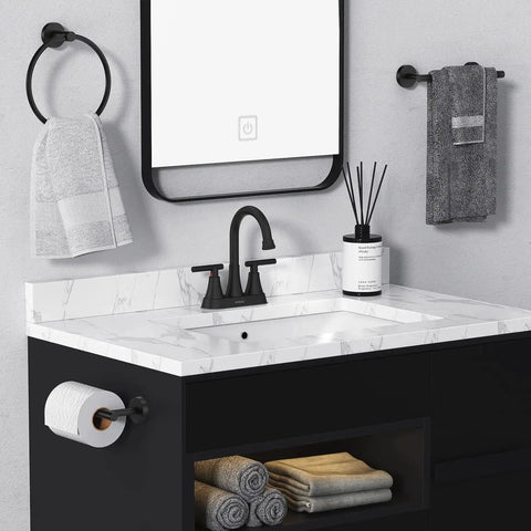 4 Inch Centerset Matte Black Bathroom Faucet With Pop Up Drain And Two Hoses installed on a white marble countertop.