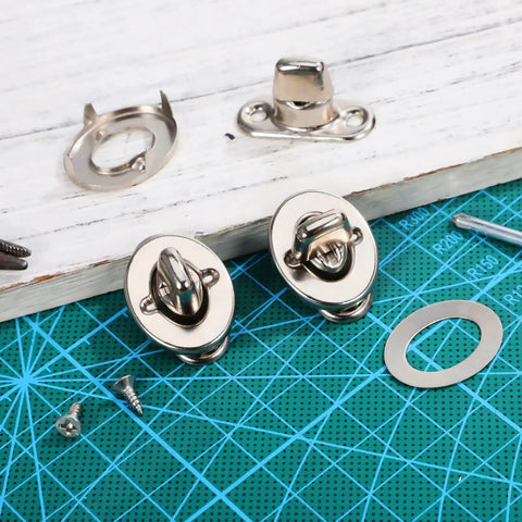 Front view: two silver marine twist-lock fasteners with eyelet studs and mounting screws