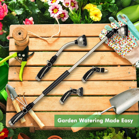 36 Inch Aluminum Watering Wand With 180 Degree Swivel Head And 10 Spray Patterns displayed with gardening tools on a wooden table.
