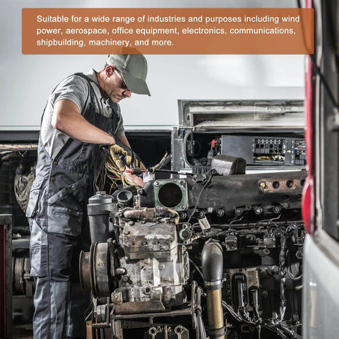 Mechanic working on engine in industrial setting, demonstrating automotive repair and assembly.